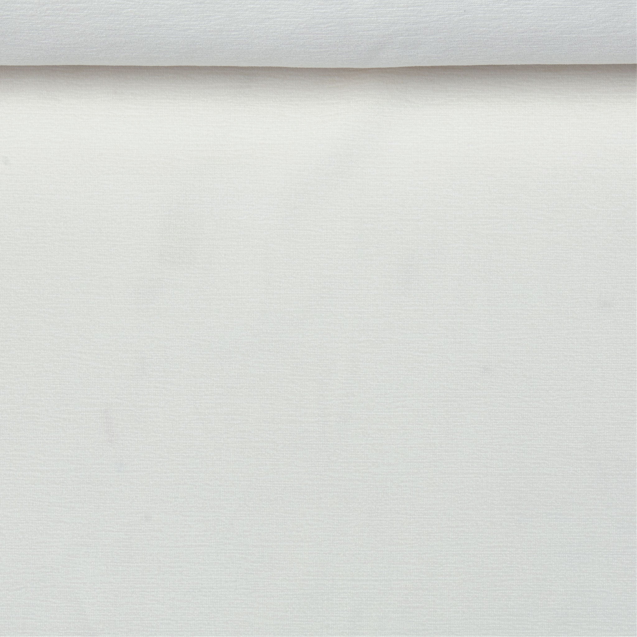 A birds eye view of a jacquard woven white terry toweled pattern outdoor performance fabric roll.