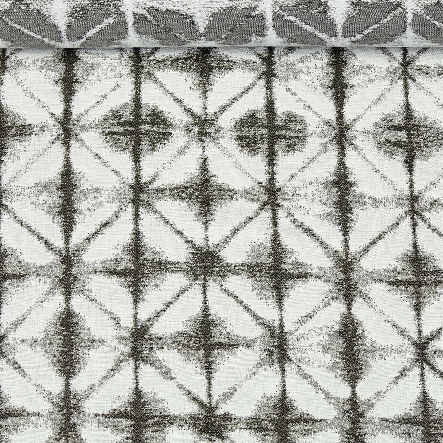 A birds eye view of a jacquard woven white and grey pattern outdoor performance fabric roll.