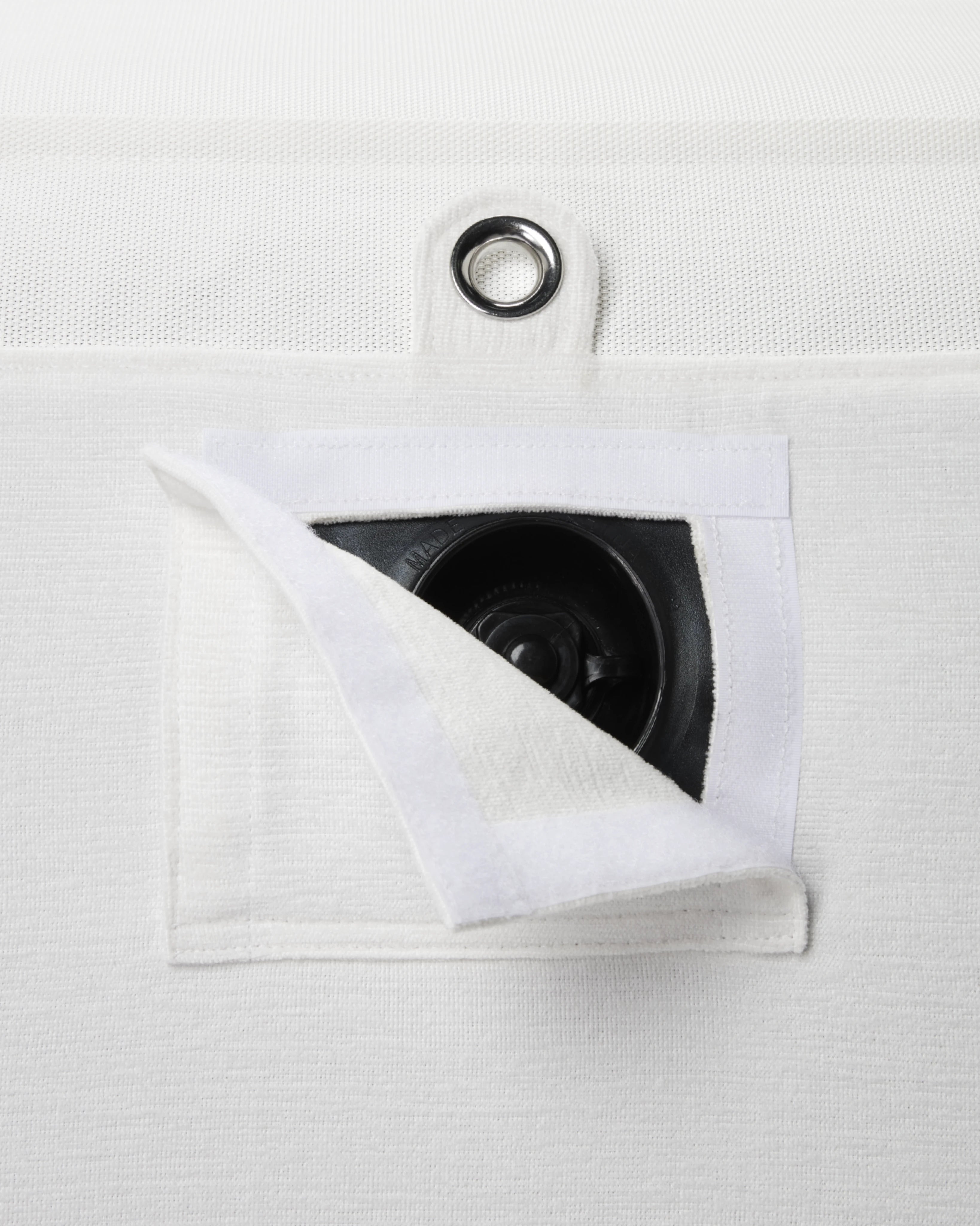Discreet inflation valve hidden beneath tailored white Chenille fabric — part of a luxury pool float with attention to detail and durable design.