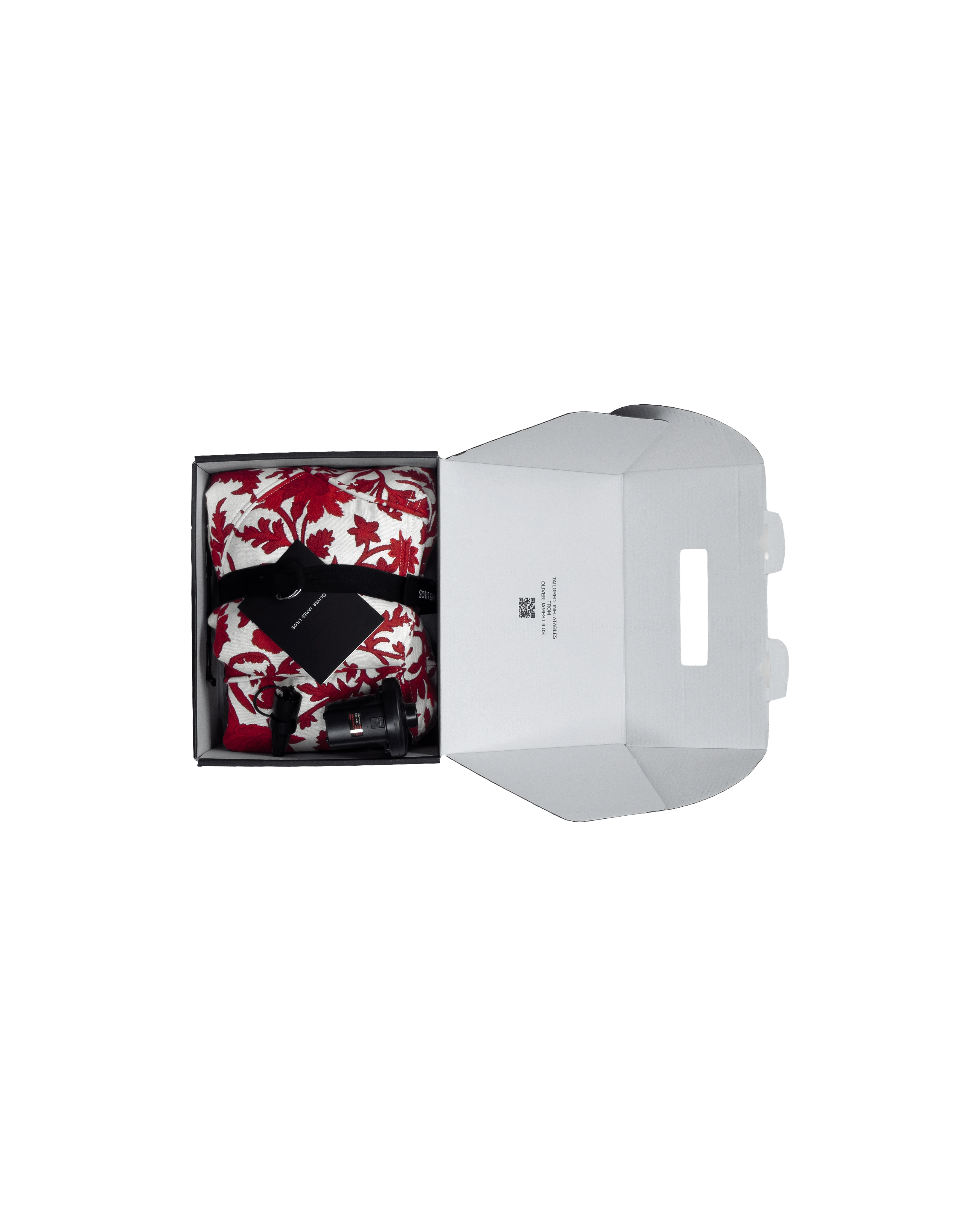 Unboxing of the round designer pool float, folded with branded ribbon in a matte black box, complete with electric pump and instructions.