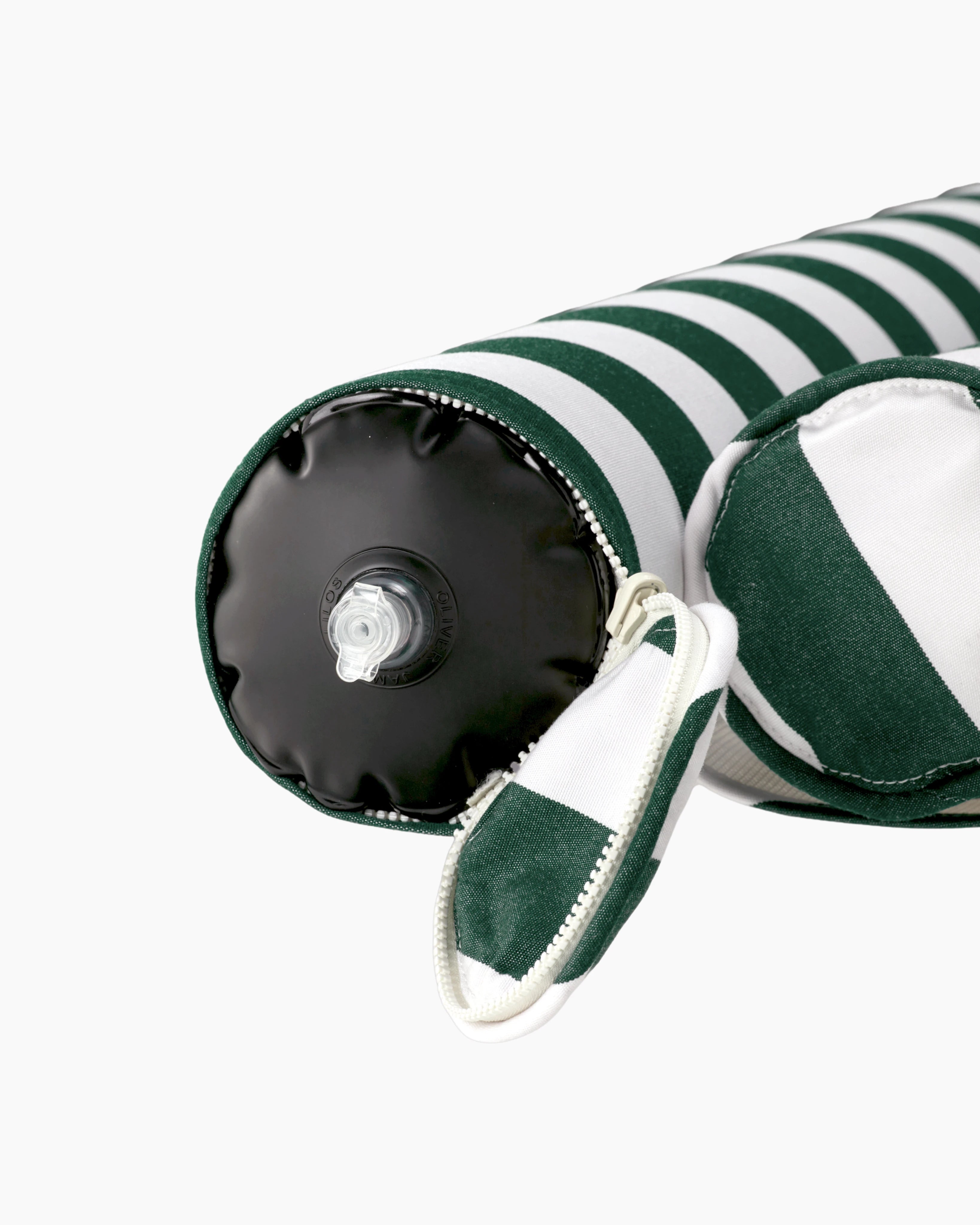 Close-up of the air valve on the end of a striped inflatable bolster, discreetly hidden by a zippered sleeve — refined design meets functional elegance.