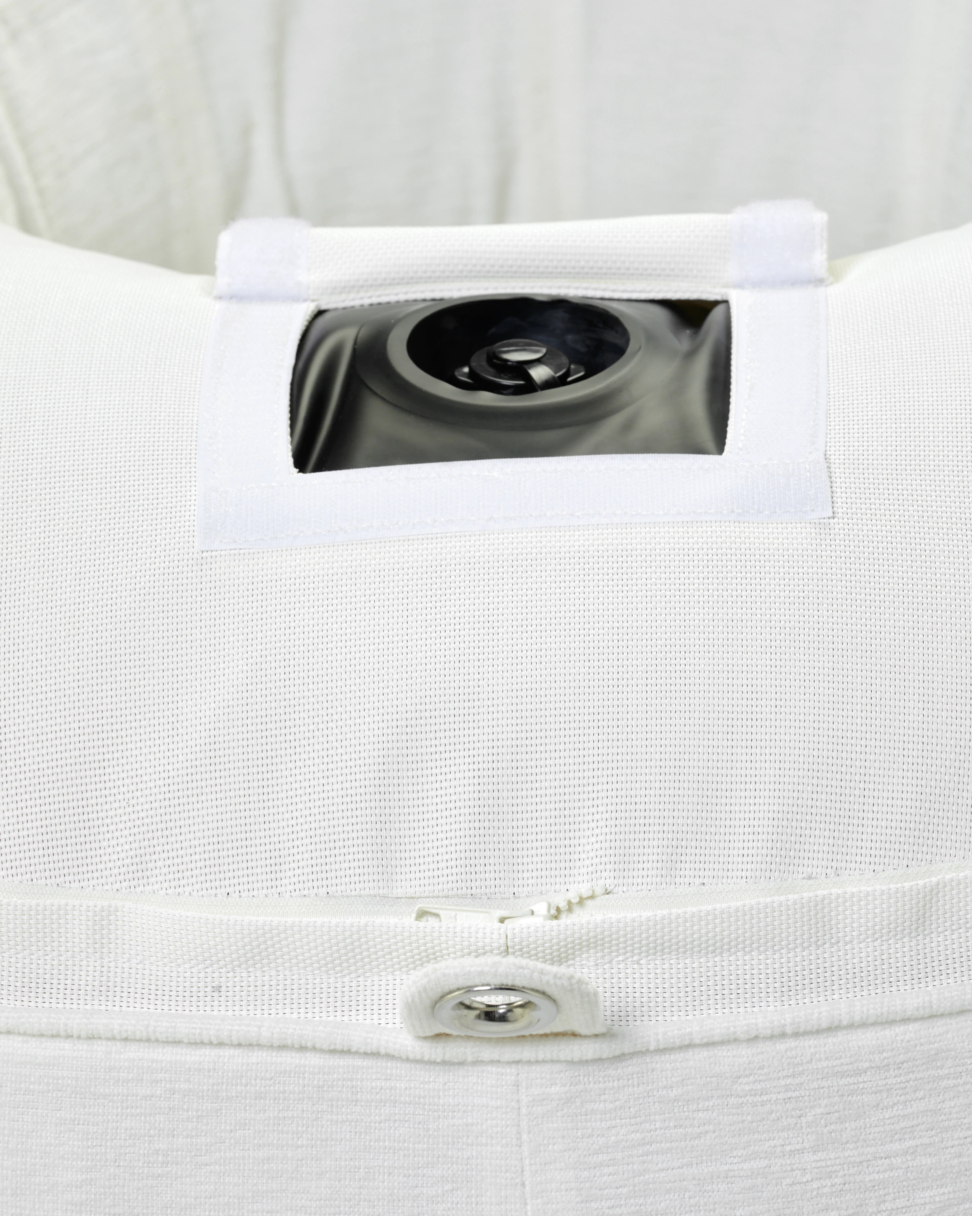Detail of the hidden inflation valve on the inside seam of the striped round pool float, showcasing discreet functionality and premium construction.