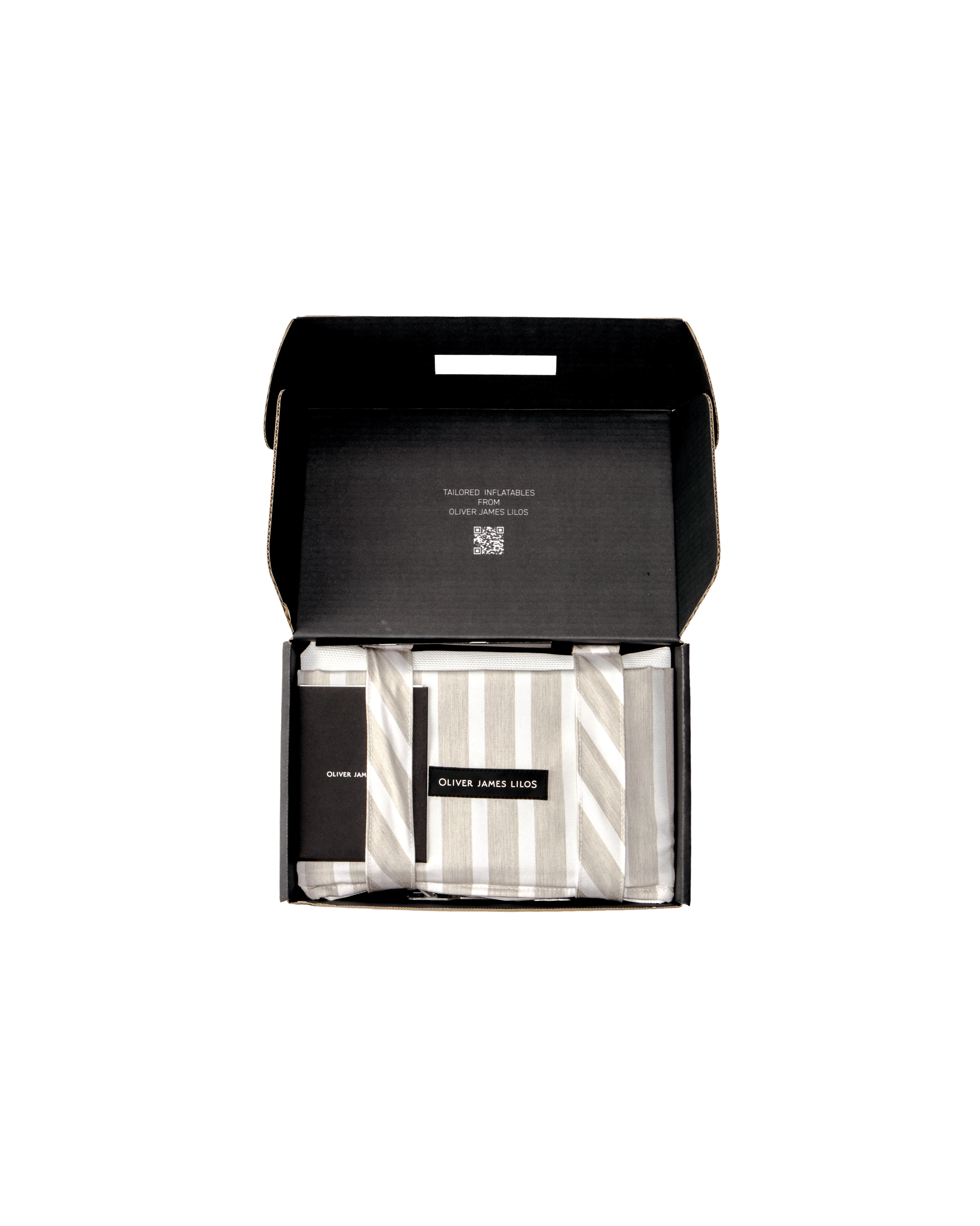 Oliver James floating hammock packed inside a sleek black box, with folded striped bolsters and branded tag — a premium pool float presented with care.