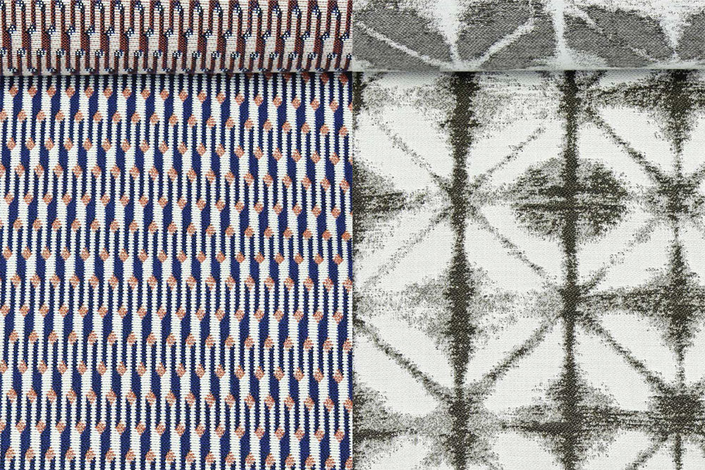 A birds eye view of two solution dyed acrylic fabric rolls.
