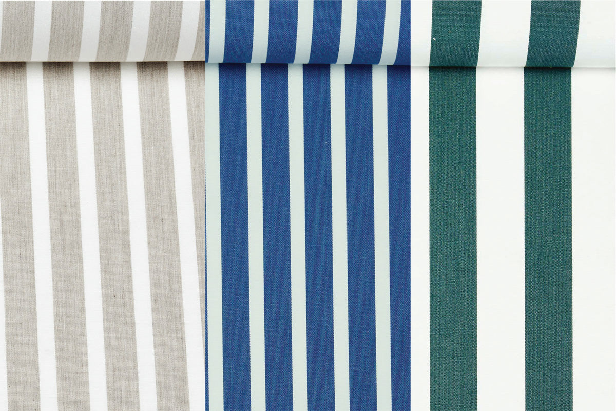 A birds eye view of three solution dyed acrylic fabric rolls.