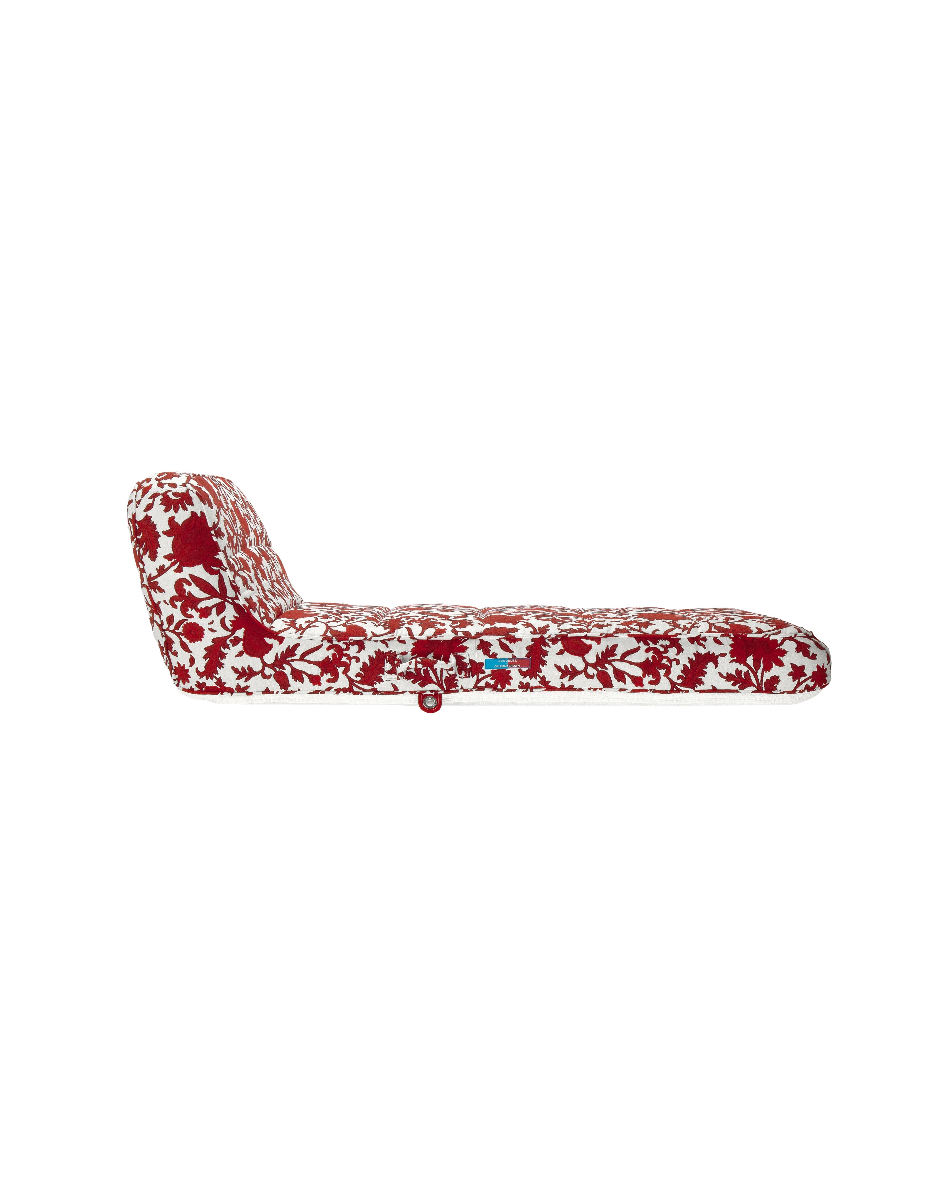 Side view of a premium designer pool float with red and white flower jacquard fabric and ergonomic back support — a high-end inflatable for elegant outdoor living.